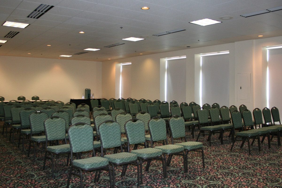 A Large Meeting Space With Rows Of Chairs